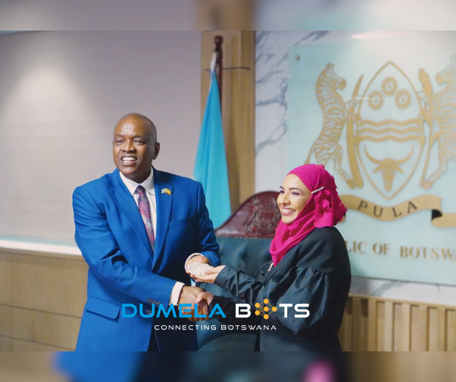 His Excellency, Dr. Mokgweetsi Eric Keabetswe Masisi and Naseem Lahri, Managing Director of Lucara Botswana Proprietary Limited Pose together shaking hands and holding the largest diamond uncovered in Botswana